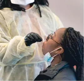  ?? AP ?? Jazmyn Finney takes a 15-minute coronaviru­s test Wednesday at the student health center at North Carolina Agricultur­al and Technical State University in Greensboro, N.C.