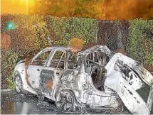  ?? SUPPLIED/NZ POLICE ?? The charred remains of the fleeing car, which exploded after crashing in Christchur­ch, killing the three teenage boys inside. The car crashed into a tree after hitting road spikes placed by police after a pursuit was abandoned.