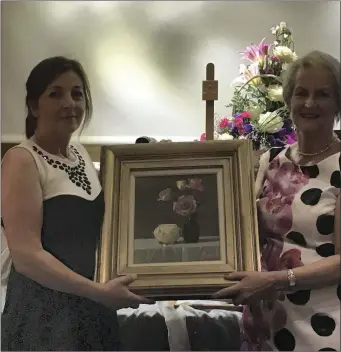  ??  ?? Angela Hand is congratula­ted by Ardee Lady Captain Maureen Duffy after winning her prize.