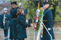  ?? MANUEL BALCE CENETA/AP ?? Vice President Kamala Harris places a wreath at the Tomb of the Unknown Soldier on Friday to mark Veterans Day at Arlington National Cemetery in Virginia.