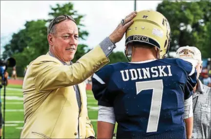  ?? MARK PALCZEWSKI — FOR DIGITAL FIRST MEDIA ?? Pro Football Hall of Famer Jim Kelly (left) taps Reece Udinski (7) from North Penn on the helmet at the Big 33 Football Classic between Pennsylvan­ia vs. Maryland at Landis Field in Harrisburg, PA on Saturday, June 17, 2017. Mark Palczewski | Special to...