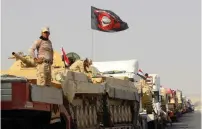  ?? (Ako Rasheed/Reuters) ?? IRAQI SECURITY FORCES stage yesterday in Kirkuk, on their way to fight against Islamic State gunmen in Mosul.