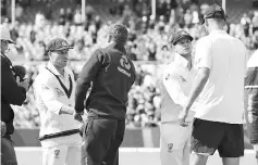  ??  ?? Players shake hands at the end of the third Ashes cricket Test match between England and Australia in Perth on December 18, 2017. - AFP photo