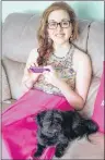  ?? THE CANADIAN PRESS/HO-ANNE SCHOFIELD ?? Rebecca Schofield sits with her dog in a June 20, 2017, family handout photo.