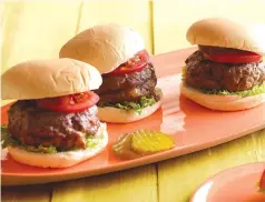  ?? ?? These wonderful cheese-stuffed burgers with bacon and caramelize­d onions are easy to adapt to suit different tastes