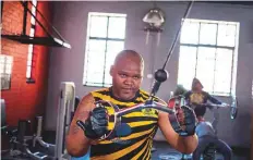  ?? AFP ?? Andy Zameko, a security guard, trains inside the gym at the YMCA Soweto. Nelson Mandela used to train there in the 1950’s.