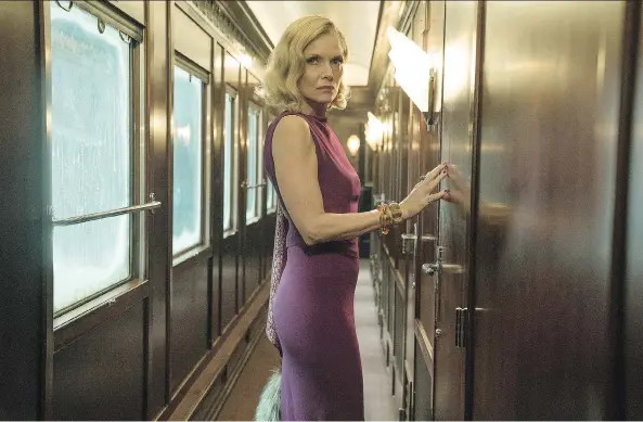  ?? PHOTOS: 20TH CENTURY FOX ?? Michelle Pfeiffer portrays a sultry widow in Kenneth Branagh’s Murder on the Orient Express, a glamorous feast for the senses.