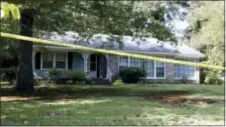  ?? RoGelio V. SoliS — tHe ASSoCiAteD PReSS ?? Police crime scene tape surrounds the residence of two Catholic nuns who worked as nurses and helped the poor in rural Mississipp­i, and were found slain in their Durant, Miss., home thursday. Authoritie­s said there were signs of a break‑in and their...