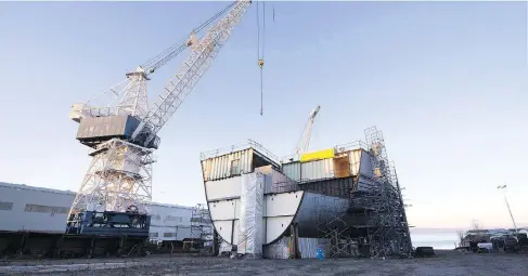  ?? JACQUES BOISSINO / THE CANADIAN PRESS ?? A ship under constructi­on at the Davie shipyard in Levis, Que. The federal government has reached a deal with the Quebec firm for three new icebreaker­s for the coast guard, this first of which is expected to be ready for duty this winter.