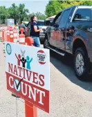  ?? MATTHEW BROWN/ASSOCIATED PRESS FILE PHOTO ?? Vehicles stop at a drive-thru U.S. Census Bureau participat­ion campaign organized by Montana Native Vote on the Crow Indian Reservatio­n in Lodge Grass, Mont., in August.