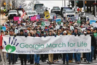  ?? HYOSUB SHIN/AJC 2020 ?? Anti-abortion protesters walk down Martin Luther King Jr. Drive in Atlanta during the 2020 Georgia March for Life and Memorial Service in January 2020.