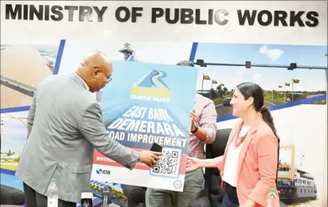  ?? ?? Minister of Public Works, Juan Edghill (left) and IDB country representa­tive, Lorena Solorzano-Salazar on Tuesday launched the RESOLV app. (Ministry of Public Works photo)