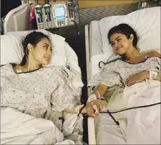  ?? THE ASSOCIATED PRESS ?? An image posted to Selena Gomez’s Instagram account shows Gomez, right, holding hands with actress Francia Raisa in a hospital. Gomez recently received a kidney transplant from Raisa due to her struggle with lupus.