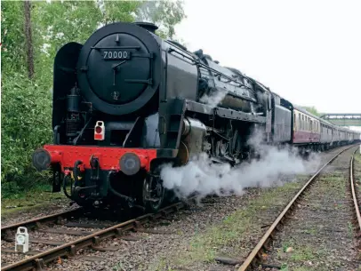  ??  ?? BR Pacific No. 70000 Britannia at Okehampton with the first stage of the return leg of Steam Dreams’ ‘Atlantic Coast Express’ on September 4-6, 2011. ROBIN JONES