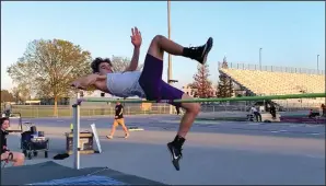  ?? COURTESY PHOTO BY MARTA BRODSKY ?? Tokay's Wyatt James clears 5 feet, 2 inches in the high jump on Thursday at Tokay High.