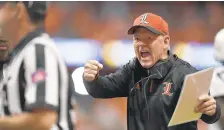  ?? ADRIAN KRAUS/AP ?? Louisville fired head coach Bobby Petrino with two games remaining in a 2-8 season. Petrino holds a 77-35 record across two stints with Louisville.