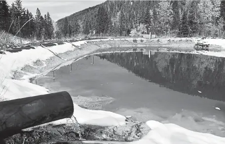  ?? Matthew Brown, The Associated Press ?? Water contaminat­ed with arsenic, lead and zinc flows from a pipe out of the Lee Mountain mine and into a holding pond near Rimini, Mont., in 2018. President Joe Biden’s infrastruc­ture plan includes billions to plug old oil and gas wells and clean up abandoned mines.