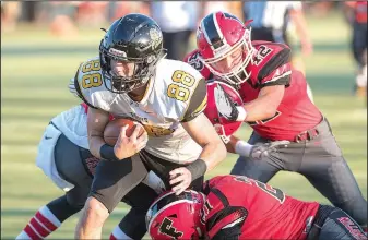  ?? NWA Democrat-Gazette/J.T. WAMPLER ?? Prairie Grove’s Colin Bryant (88) fights his way into the end zone through a trio of Farmington defenders Tuesday in Farmington.