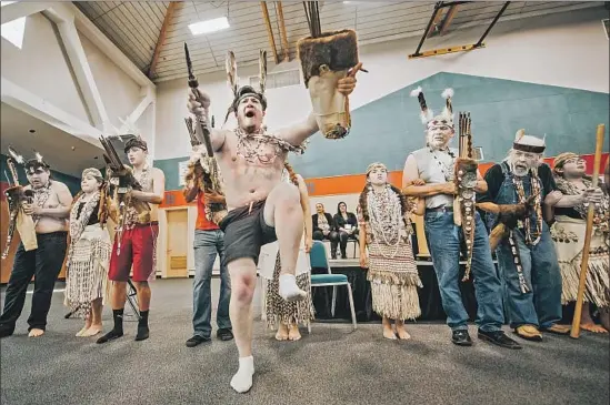  ?? Photograph­s by Eddy Alexander ?? TRIBAL DANCERS lead a ceremonial performanc­e after the city of Eureka, Calif., signed a deed Monday effectivel­y returning Indian Island to the Wiyot people.