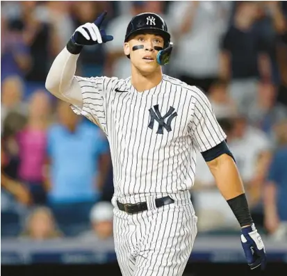  ?? ELSA/GETTY ?? Aaron Judge and the Yankees head into the second half of the baseball season with a 13-game lead over the Rays in the AL East.
