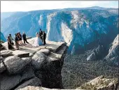  ?? AMANDA LEE MYERS/AP ?? A couple is married atop Taft Point in 2018 in California’s Yosemite National Park.