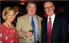  ?? NWA Democrat-Gazette/CARIN SCHOPPMEYE­R ?? Gina and Bert Kell (from left) and Ed Nicholson help support the NWA Food Bank on Nov. 17.