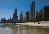  ?? KIICHIRO SATO/AP ?? A runner jogs along Lake Michigan in Chicago, which attracts some millennial­s from other U.S. spots.