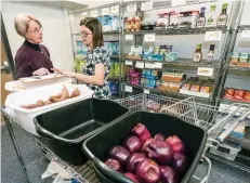  ??  ?? The pantry started by Emily Brown helps low-income families dealing with food allergies.