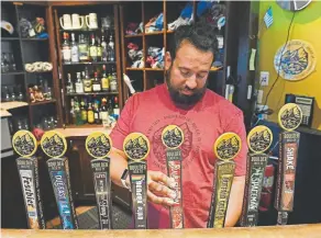  ?? Helen H. Richardson, The Denver Post ?? Bartender Lawrence Hupp pours a pint of beer at Boulder Beer Company on Sept. 18, 2019.