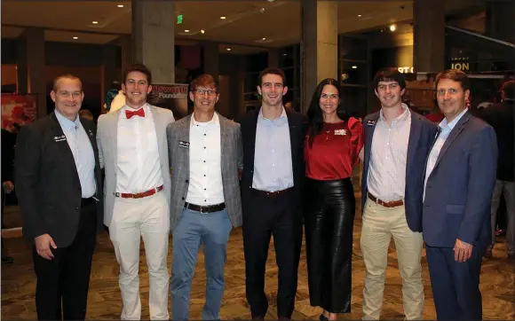  ?? (NWA Democrat-Gazette/Carin Schoppmeye­r) ?? Steve Colquit (from left); Knox Bennett; Stetson Bennett III; Stetson Bennett IV, 2022 Burlsworth Trophy winner; Denise Bennett; Luke Bennett and Buster Faulker stand for a photo Dec. 5 at the announceme­nt ceremony at Crystal Bridges Museum of American Art.