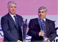  ?? PTI file ?? ICC Chief Executive David Richardson and ICC Chairman Shashank Manohar pose with the trophies. —