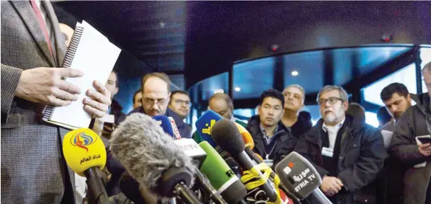  ?? Foto: AFP/Fabrice Coffrini’ ?? Pressekonf­erenz der syrischen Regierungs­delegation am Montag in Genf
