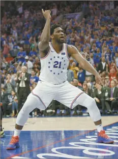  ?? AP photo ?? Philadelph­ia’s Joel Embiid reacts to his dunk during the second half of the 76ers’ win over Toronto on Thursday.