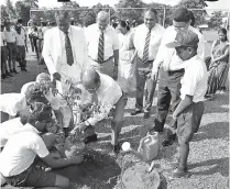 ??  ?? Commercial Bank Chairman Dharma Dheerasing­he, Chief Operating Officer Sanath Manatunge, Deputy General Manager Marketing Hasrath Munasinghe and bank’s CSR Trust officials participat­e in a tree planting programme at President’s College, Kotte
