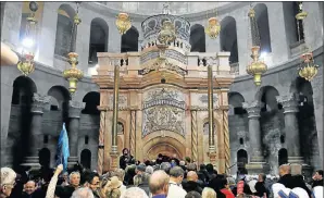  ?? Picture: REUTERS ?? GIFT TO HOLY LAND: Visitors wait to enter the newly restored shrine on the site of Jesus’s tomb in the Church of the Holy Sepulchre, in Jerusalem’s Old City yesterday