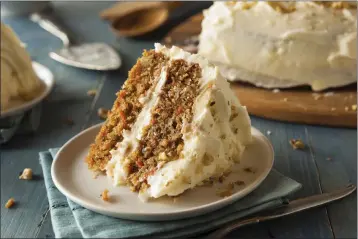  ?? GETTY IMAGES ?? Carrot cake is the quintessen­tial American dessert, whether you make it in a 9-by-13pan or a double-decker round.