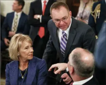  ?? CAROLYN KASTER — THE ASSOCIATED PRESS FILE ?? Education Secretary Betsy DeVos, left, acting White House chief of staff Mick Mulvaney, center, and Louisiana Gov. John Bel Edwards talks before President Donald Trump arrives to speak.