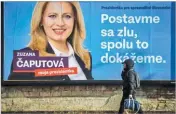  ??  ?? VLADIMIR SIMICEK/AFP A billboard in Bratislava of front running presidenti­al candidate Zuzana Caputova reads: “Stand up against evil, together we can do it”.