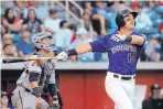  ?? JIM THOMPSON/JOURNAL ?? Albuquerqu­e’s Mike Tauchman and Reno catcher Michael Perez watch the flight of one of two Tauchman home runs on Saturday.