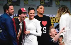  ??  ?? Moderator Chris Hardwick, foreground right, takes a selfie with from left, Ben Affleck, Ezra Miller, Gal Gadot, and Ray Fisher at the Warner Bros "Justice League" panel on day three of Comic-Con Internatio­nal in San Diego. — AP photos