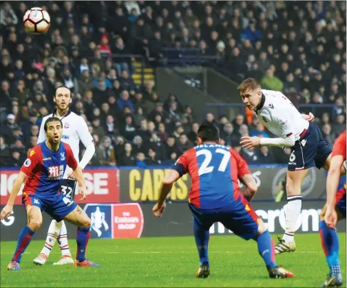  ??  ?? CLOSE: Bolton midfielder Josh Vela rises high but hits the post with a powerful header