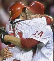  ?? Associated Press ?? Roy Halladay, right, authored one of only two no-hitters in postseason history. While pitching for the Phillies Oct. 6, 2010, he no-hit Cincinnati in Game 1 of a National League Division Series.