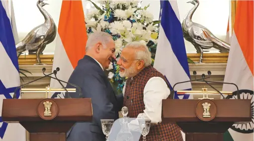  ?? (Adnan Abidi/Reuters) ?? PRIME MINISTER Benjamin Netanyahu and his Indian counterpar­t, Narendra Modi, hug after attending a ceremony at which agreements were signed between the two countries in several sectors, in New Delhi, in 2018.