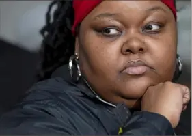  ?? Steph Chambers/Post-Gazette ?? Jameela Tyler, mother of Marcus White Jr., listens as Paul Jubas, the attorney representi­ng her family, speaks Thursday outside the City-County Building in Downtown. Marcus was 15 months old when he was killed at a picnic in East Hills in 2013. Mr. Jubas demanded charges be filed against a man who allegedly confessed to the killing and said District Attorney Stephen A. Zappala Jr. should step down for failing to prosecute him.