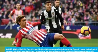  ??  ?? MADRID: Atletico Madrid’s French forward Antoine Griezmann eyes the ball during the Spanish League football match between Club Atletico de Madrid and Levante UD at the Wanda Metropolit­ano stadium in Madrid yesterday. — AFP