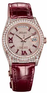  ??  ?? Oyster Perpetual Day-Date 36 in 18 ct Everose gold and diamonds with a burgundy leather strap and
matching appliques