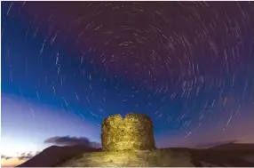  ??  ?? Above, a historic Spanish tower in Sardinia. Below, three photograph­ers leading the 14-day Special Antarctica Photograph­ic Charter, Paul Goldstein, Chris Packham and Mark Carwardine.