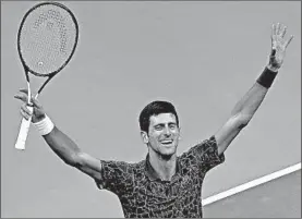  ?? BRIAN HIRSCHFELD/EPA ?? Novak Djokovic celebrates after beating Juan Martin del Potro in straight sets to win the U.S. Open on Sunday. It was the second straight Grand Slam title for Djokovic.