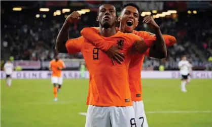  ??  ?? Georginio Wijnaldum celebrates the Netherland­s’ fourth goal with Donyell Malen. Photograph: Morris Mac Matzen/Reuters