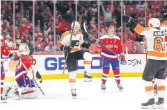  ?? USA TODAY SPORTS ?? Flyers centre Kevin Hayes, centre, celebrates after scoring a goal against the Capitals on Wednesday.